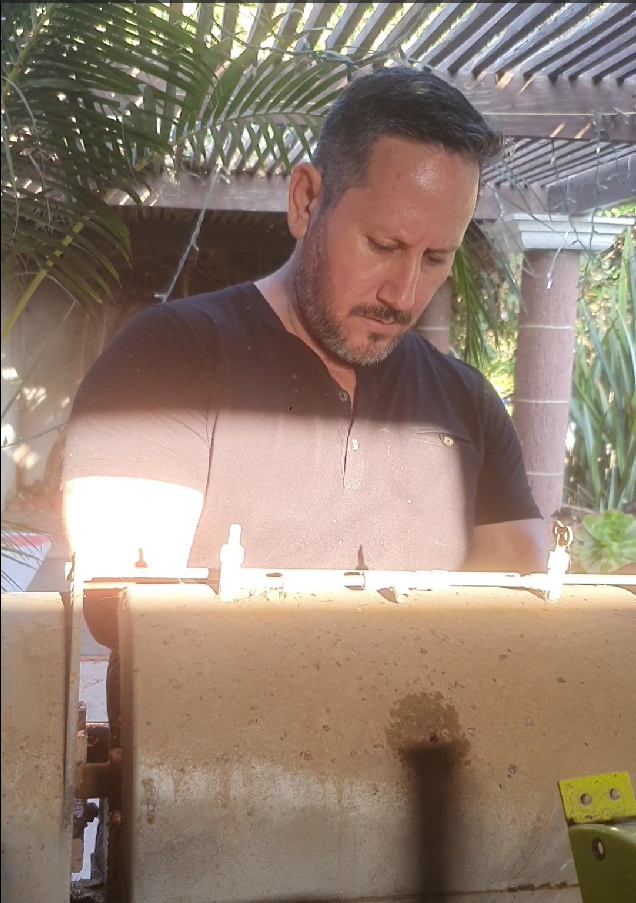 Carlo working with lapidary equipment